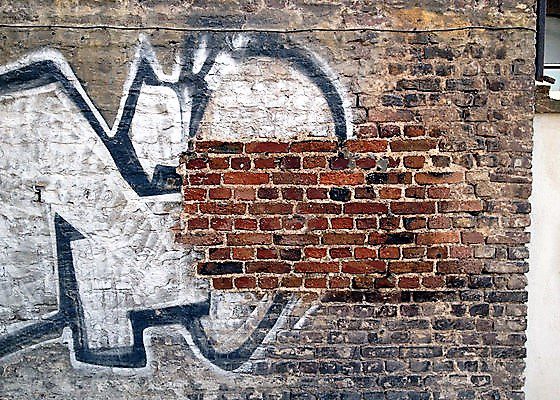 Brick Wall With Graffiti